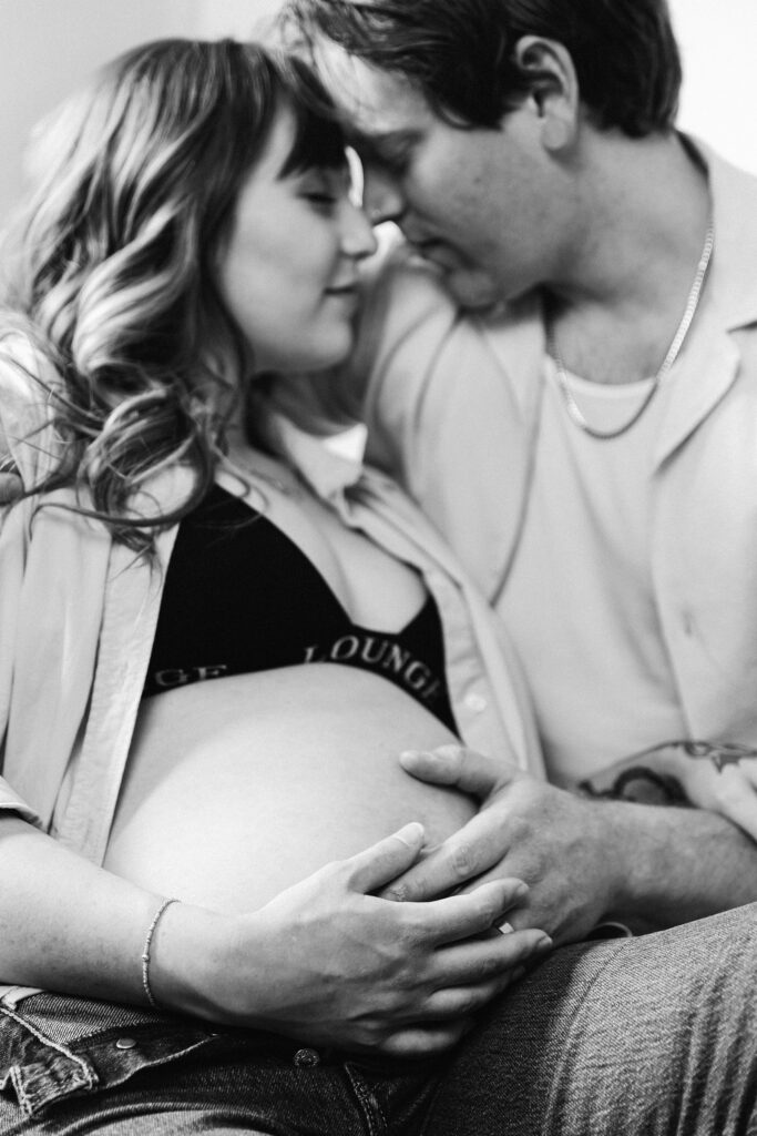 Expectant couple embracing during their San Diego maternity session
