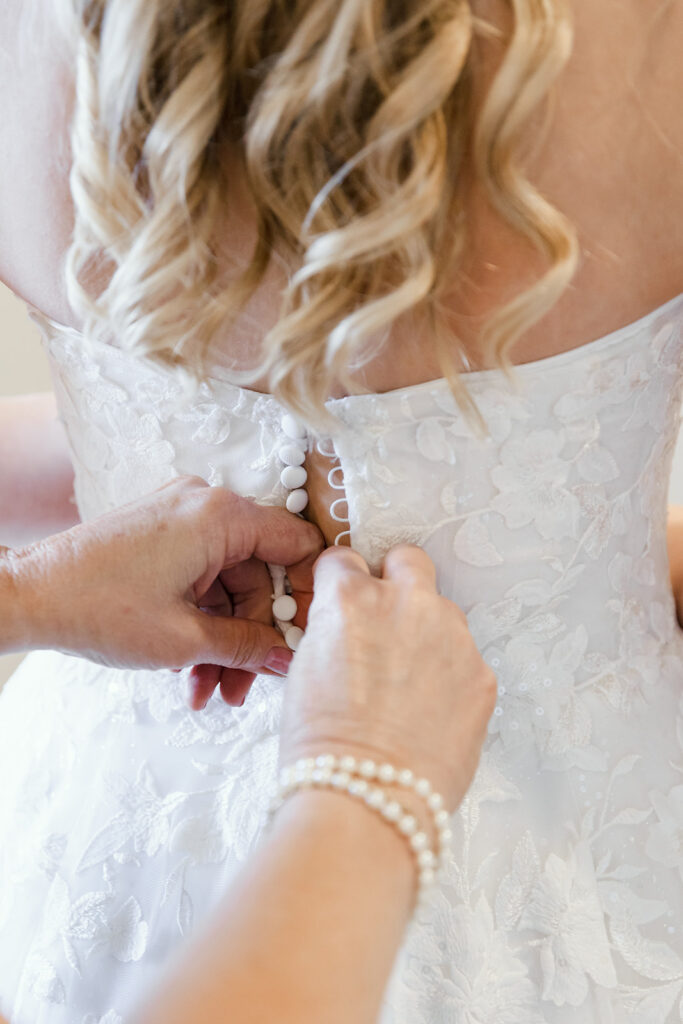 Details of mother of the bride button up the dress