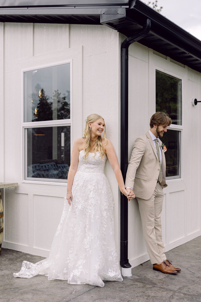Bride and groom smiling at the first touch