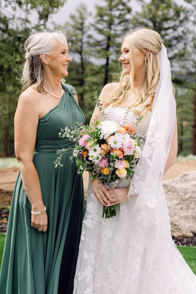 Bride and mother of the bride looking at each other