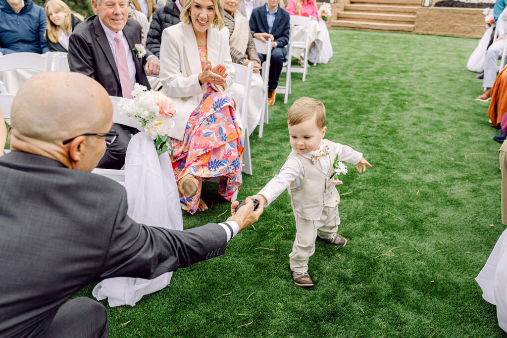 Kid give wedding rings to the celebrant