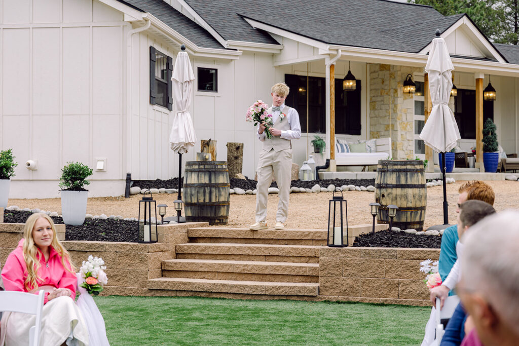Brother of the bride entrance with flowers