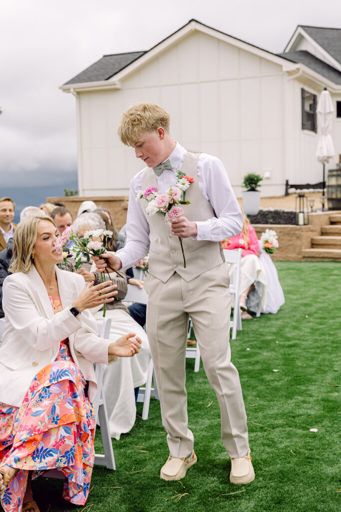 Brother deliver flowers to the women in the aisle