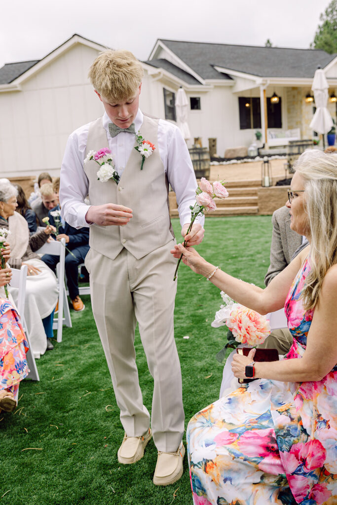 Brother deliver flowers to the women in the aisle