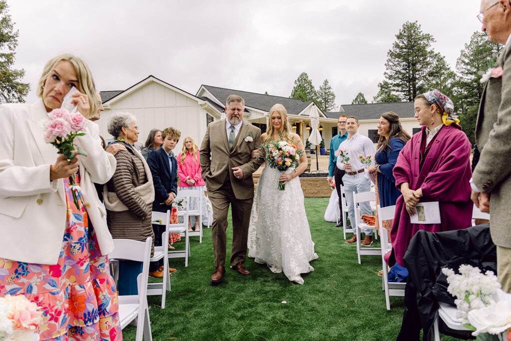 bride and father emotional walking down the aisle 