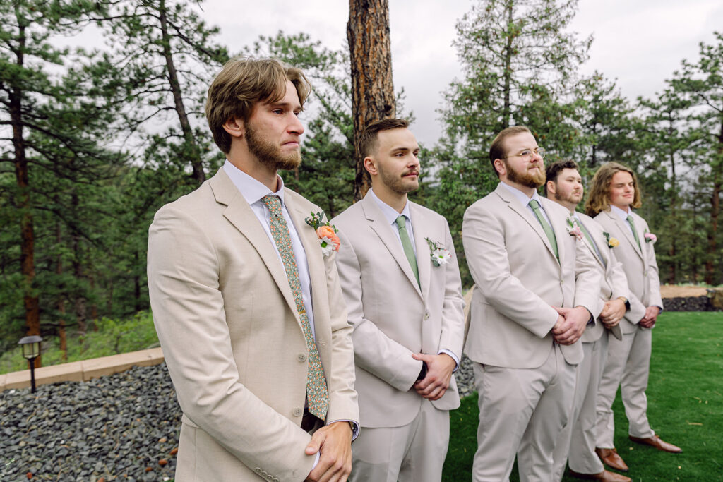 Groom and Groomsmen watching the bride arrival