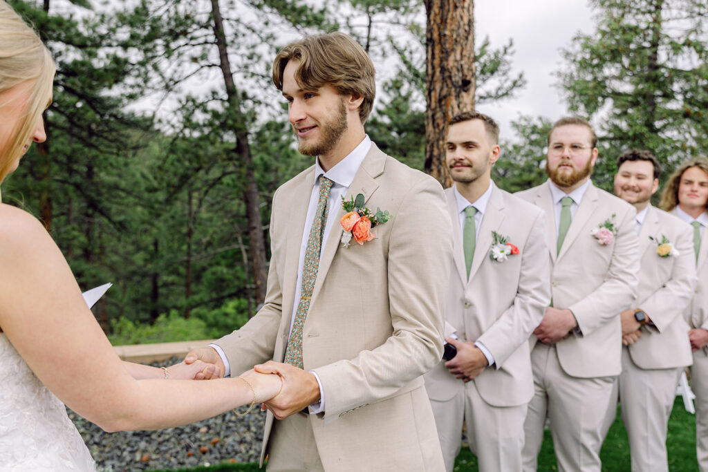 Groom smiling during ceremony